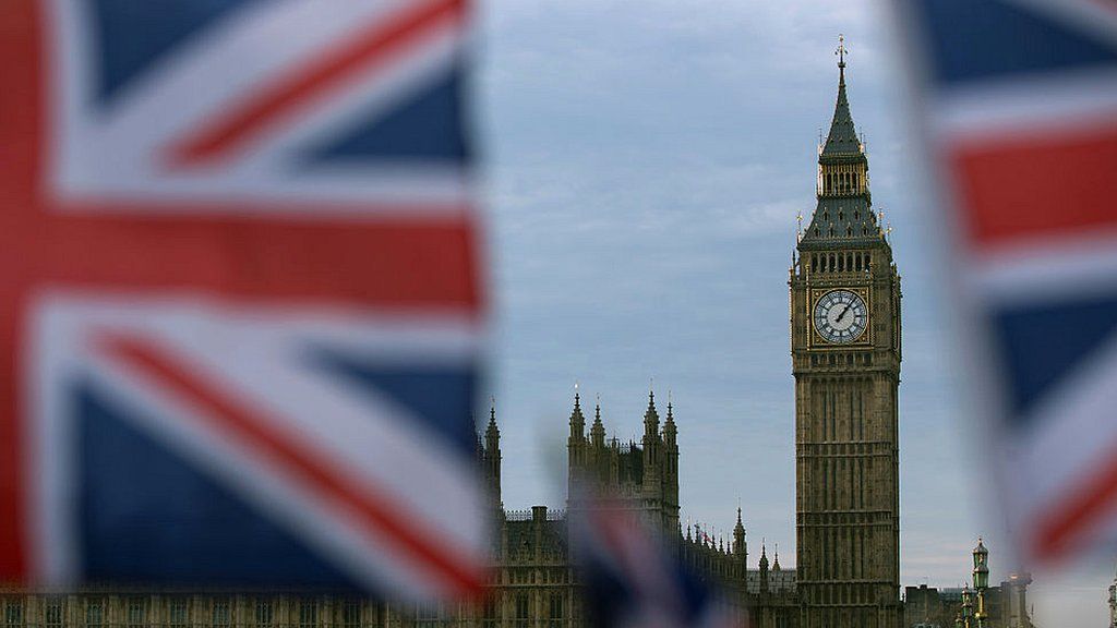 A British Union flag flies near the Elizabeth Tower, otherwise known as Big Ben, opposite the Houses of Parliament in central London