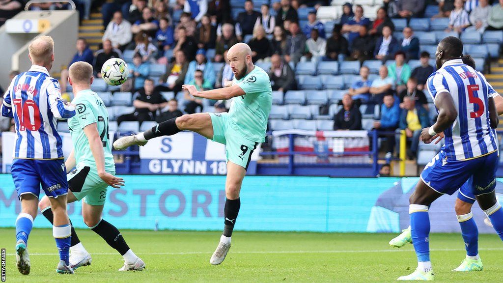 Paddy Madden scored his first goal of the season as Stockport County had threatened to upset Sheffield Wednesday before the Owls' late comeback