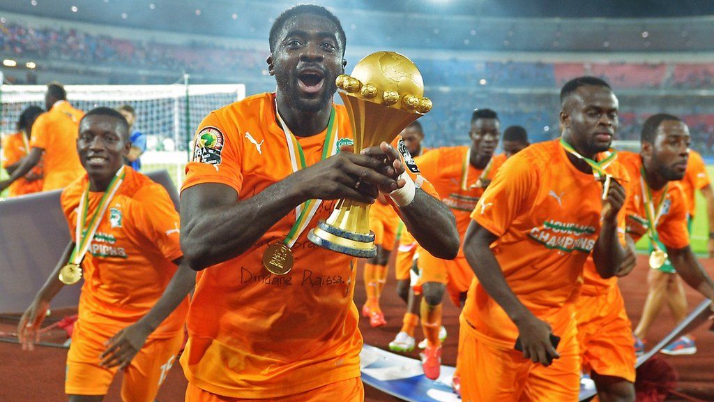 Ivory Coast defender Kolo Toure celebrates with the Africa Cup of Nations trophy in 2015