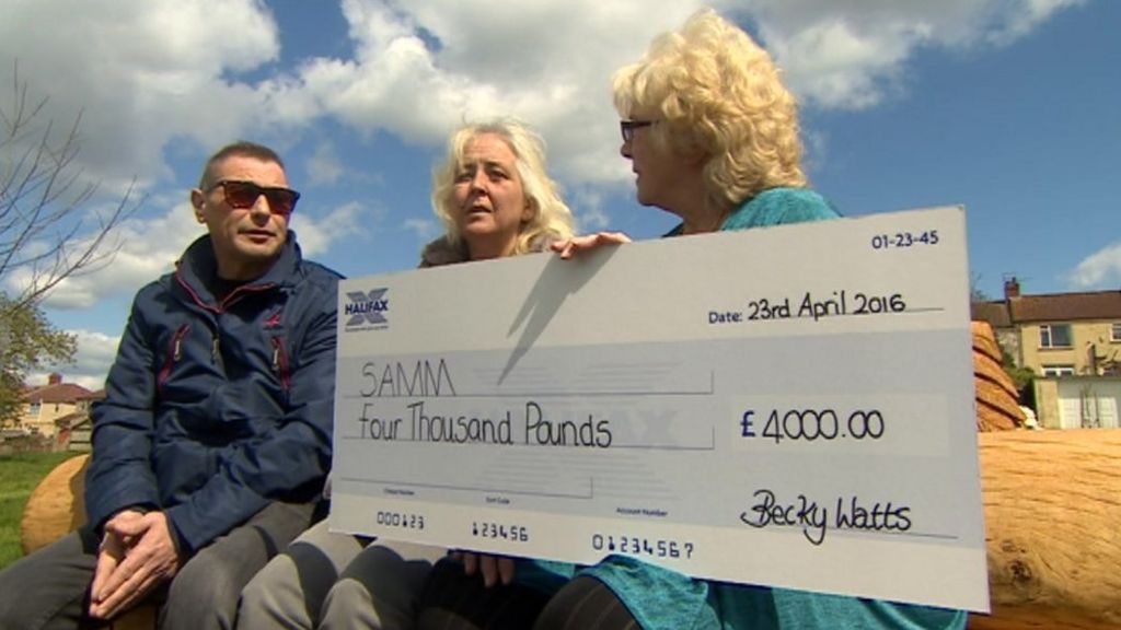 Becky Watts's family with a cheque for £4,000