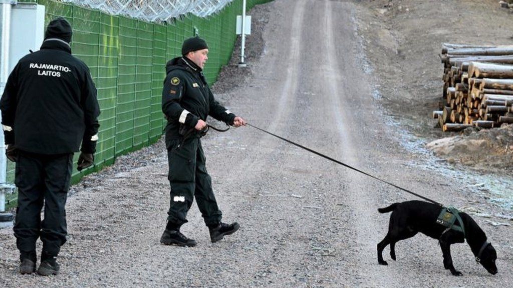 Finnish border guards patrol the frontier with Russia