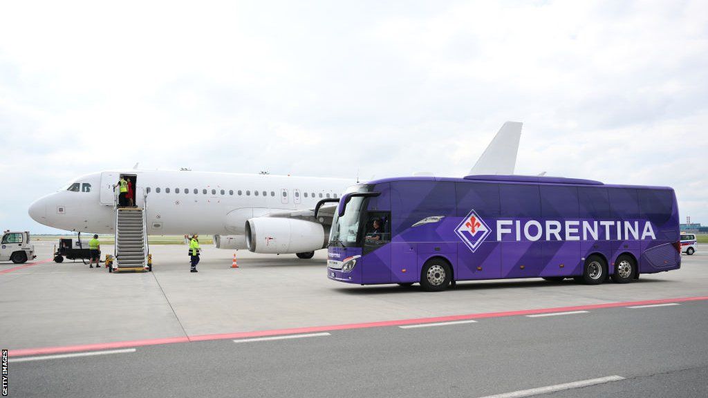 Fiorentina team coach at the airport near to a plane