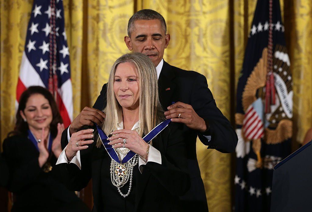 Barbra Streisand receives the Presidential Medal of Freedom from Barack Obama