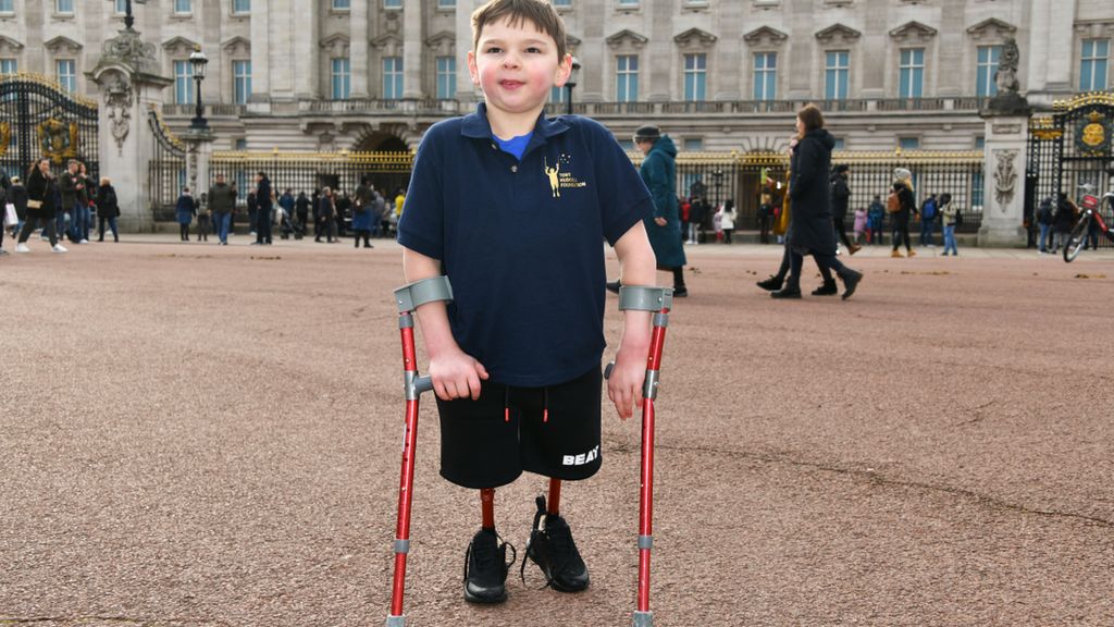 Tony Hudgell poses outside Buckingham Palace to celebrate Jack Hopkins running 100 days to raise funds for the Tony Hudgell Foundation on 5 February 2022 in London