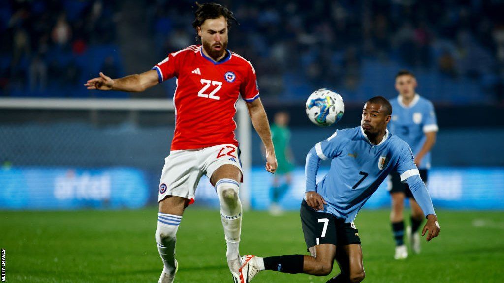 Ben Brereton Diaz with his eyes on the ball playing for Chile in a World Cup qualifier against Uruguay