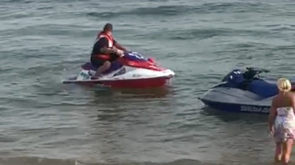 Jet skis in water near beach