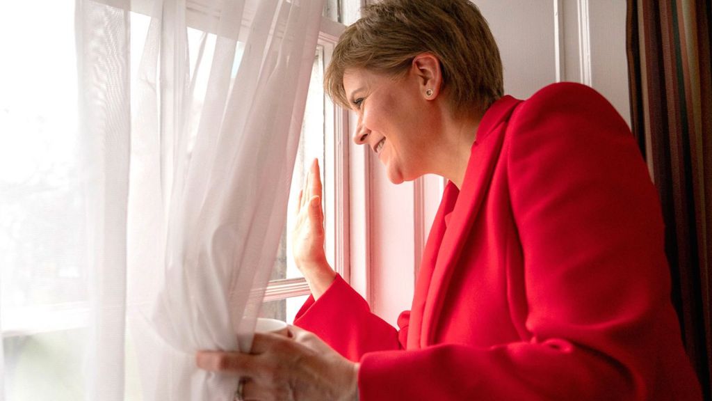 First Minister Nicola Sturgeon waves from a window of Bute House in Edinburgh after announcing she was standing down as first minister of Scotland after eight years - 15 February 2023