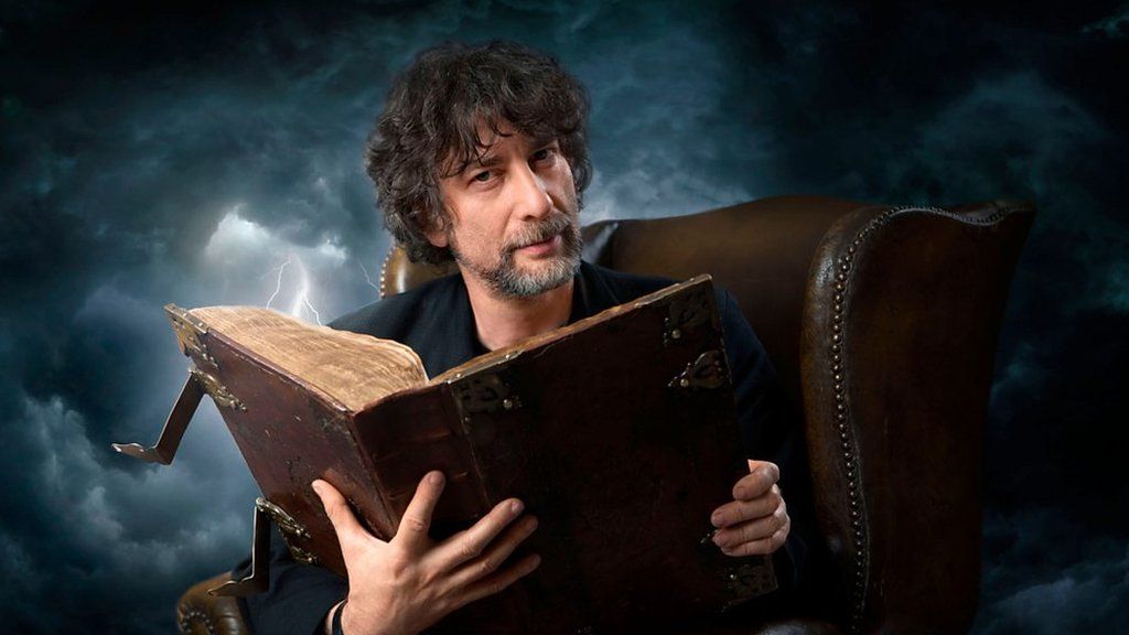 Neil Gaiman reading a book