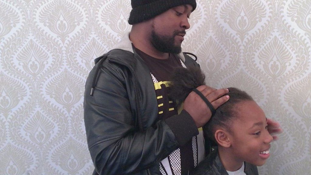 Dad doing his girl's hair