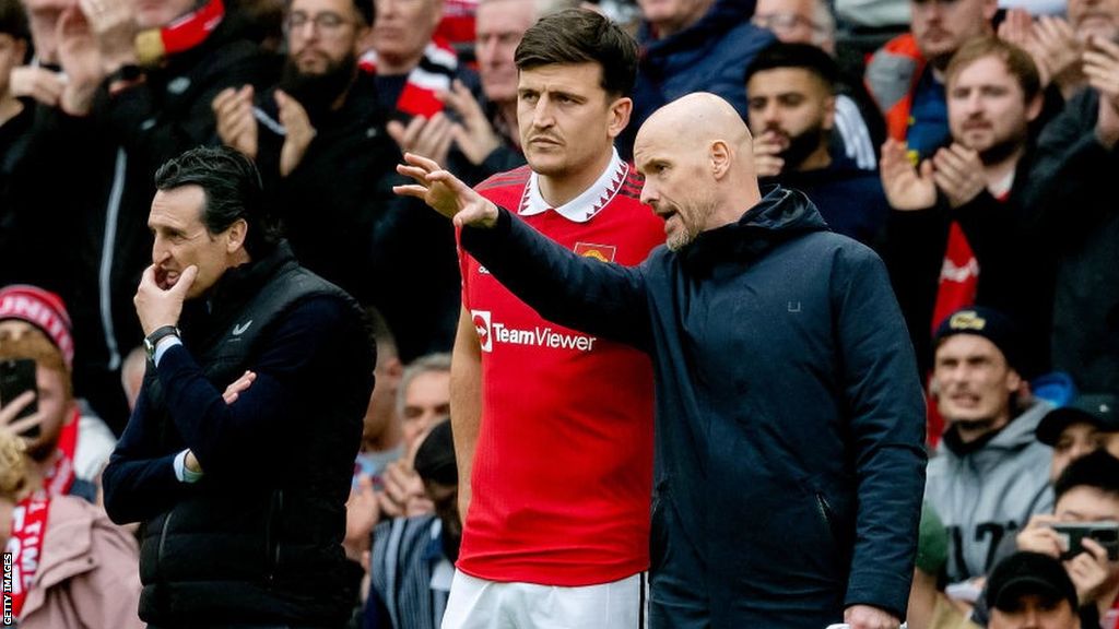 Erik ten Hag (right) gives Harry Maguire instructions on the touchline