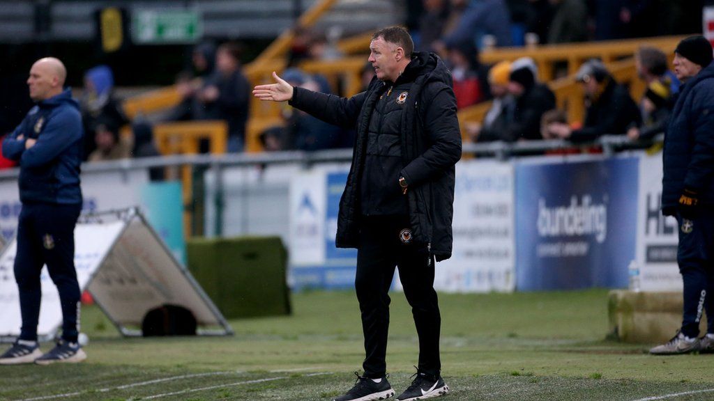 Newport manager Graham Coughlan tries to get his point across.