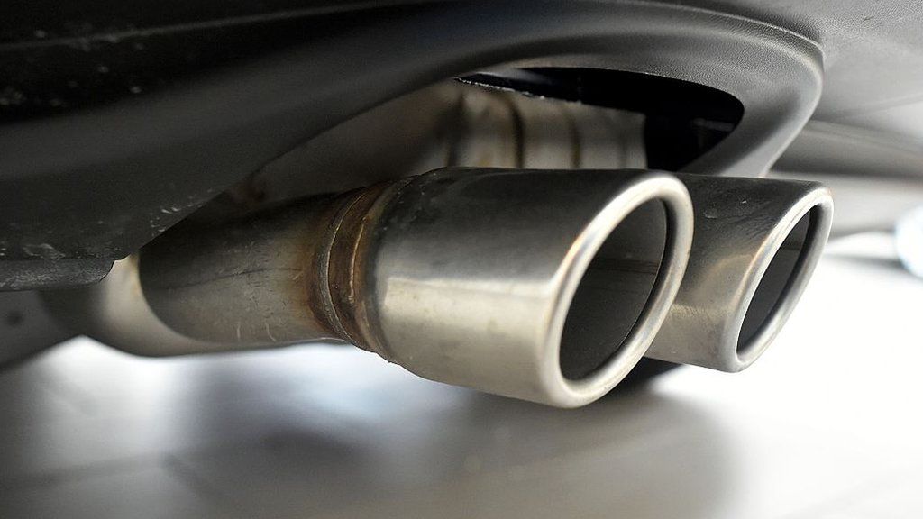 Exhaust pipes are seen on a Volkswagen vehicle at an auto dealership in San Francisco, California