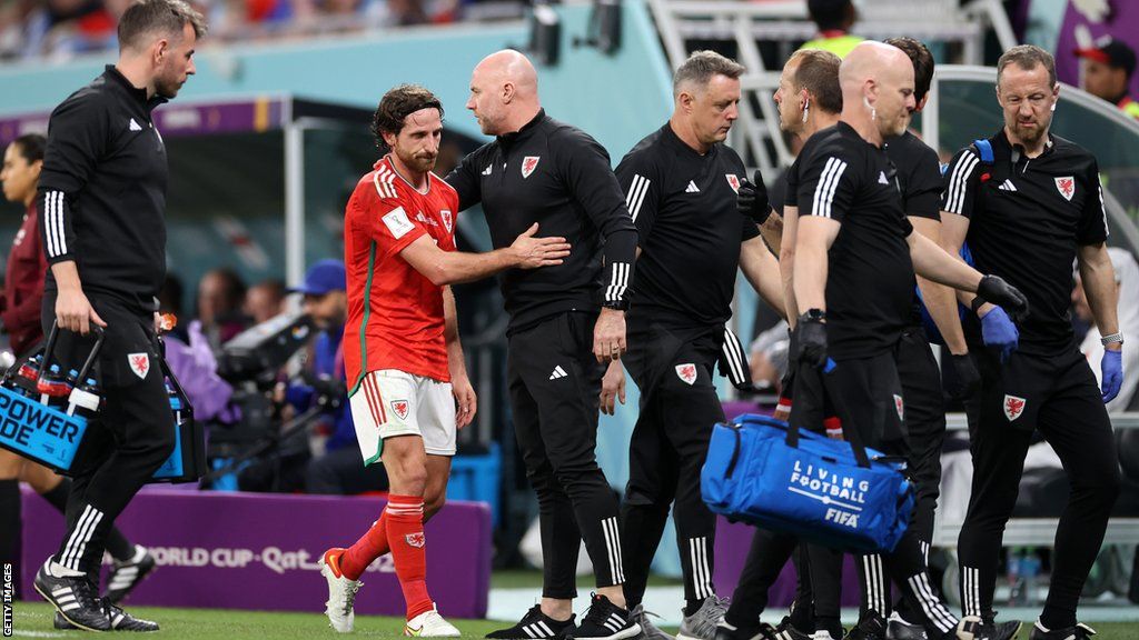 Joe Allen acknowledges Rob Page after being substituted in his final Wales appearance, the 3-0 defeat to England last November