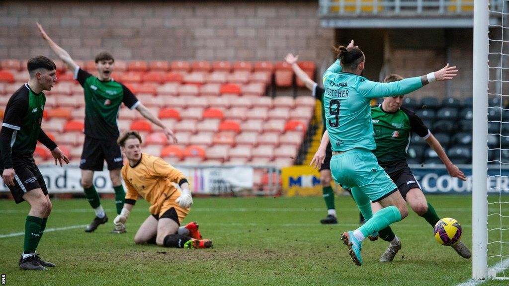 University of Stirling clear a Dundee United attempt off the line