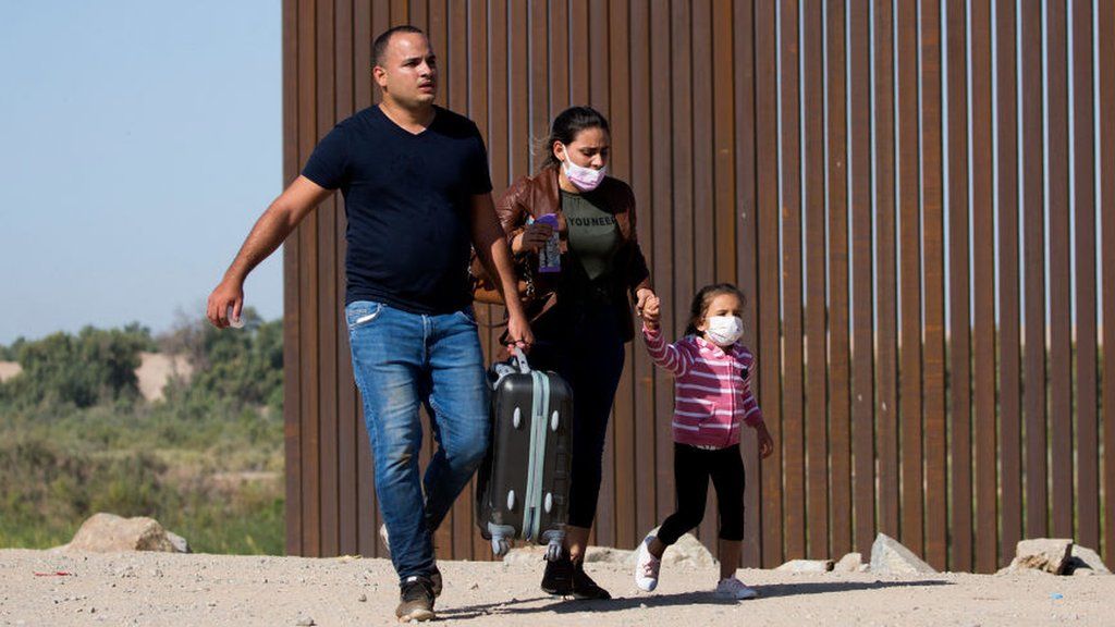 Migrants crossing border