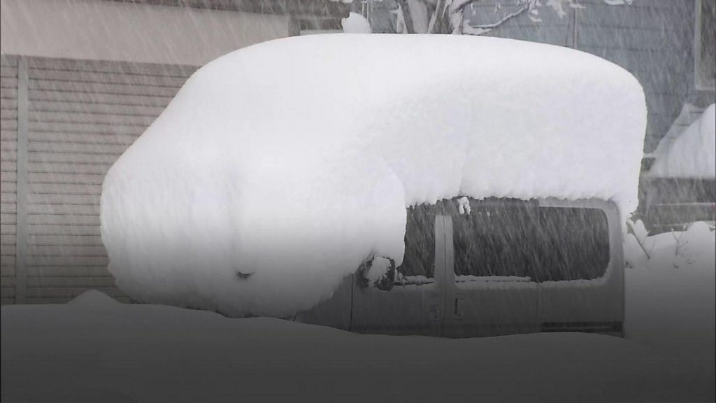 Deep snow on top of a car in Japan