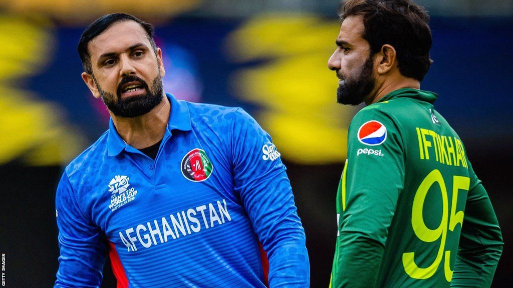 Afghanistan's Mohammad Nabi and Pakistan's Iftikhar Ahmed in 2022