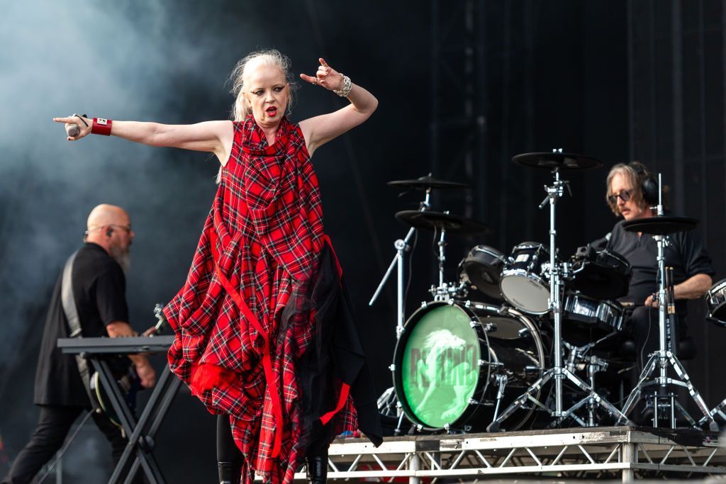 Singer Shirley Manson wearing red tartan dress