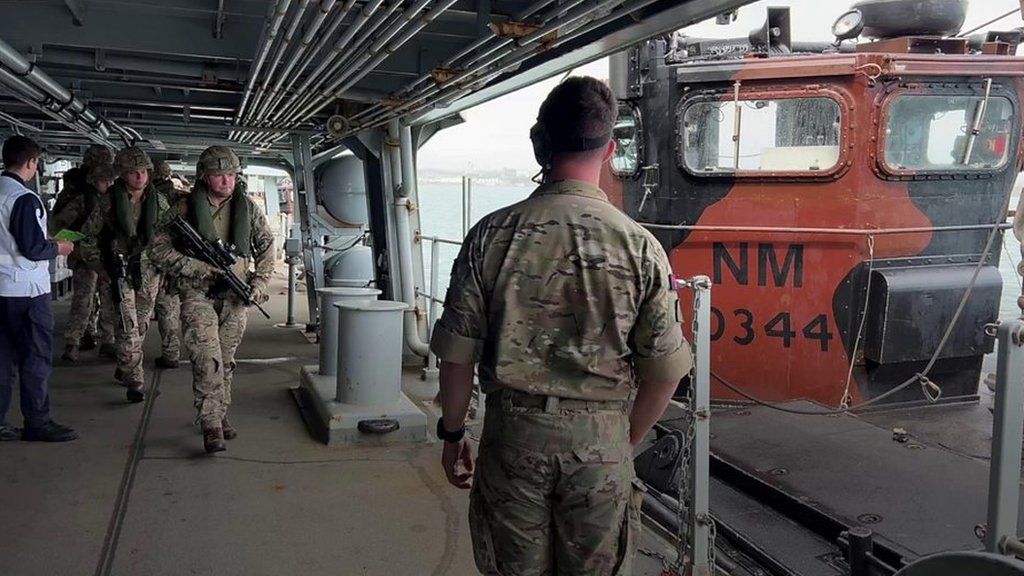 Royal Marines board a landing craft