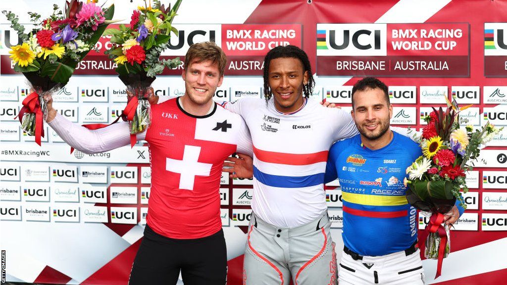 Kye Whyte celebrates winning gold at the BMX Racing World Cup