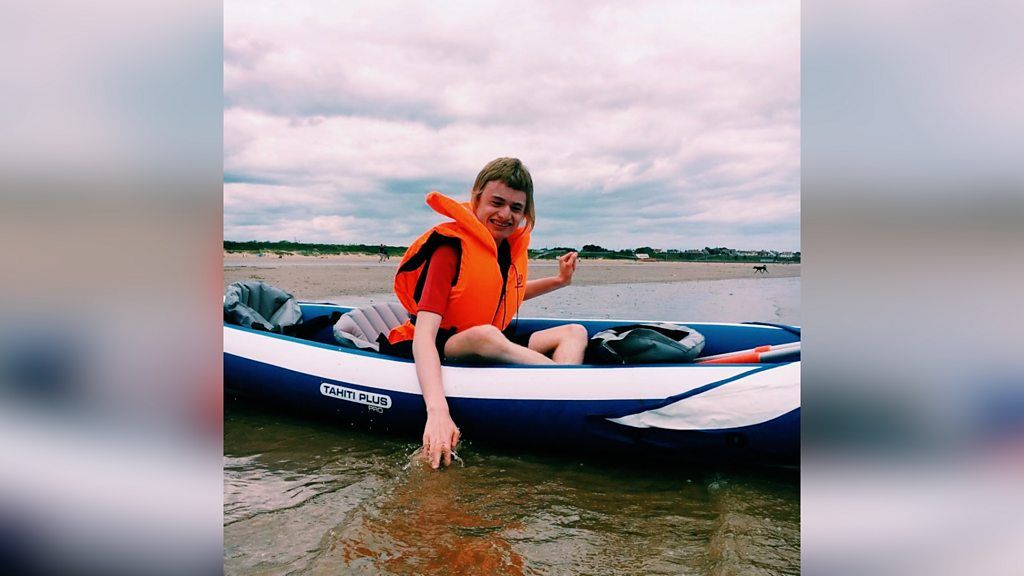 Boy on an inflatable kayak