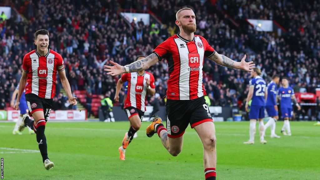 Oli McBurnie celebrates scoring against Chelsea