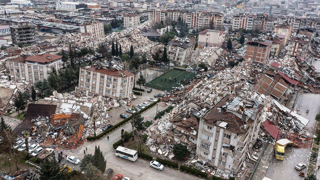 An aerial view of debris of collapsed buildings in Hatay