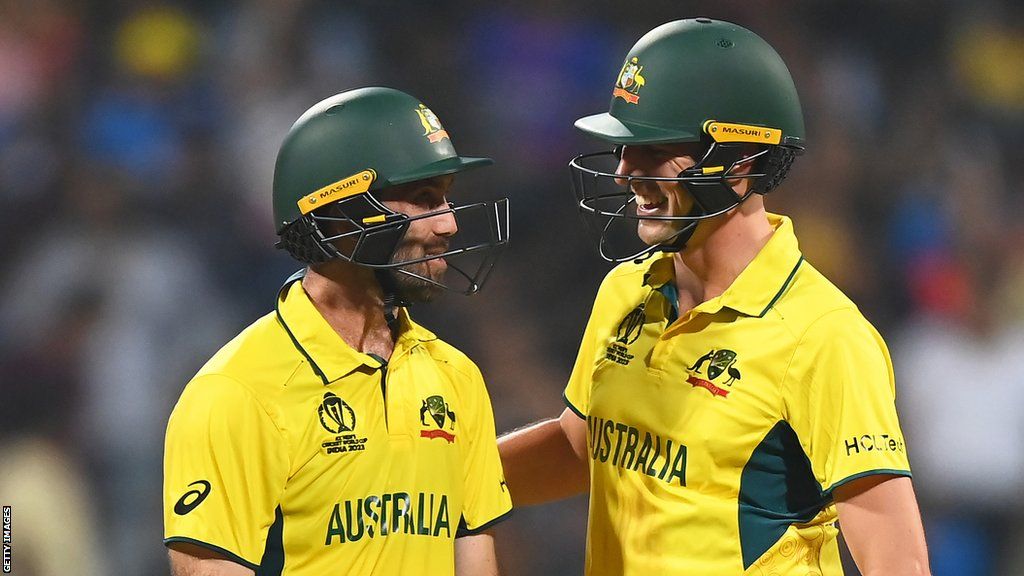 Australia's Pat Cummins and Glenn Maxwell smile during their record-breaking partnership of 202 against Afghanistan at the Cricket World Cup