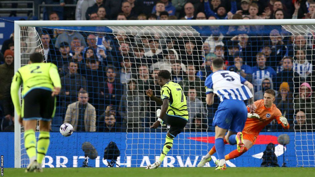Bukayo Saka scores a penalty for Arsenal against Brighton