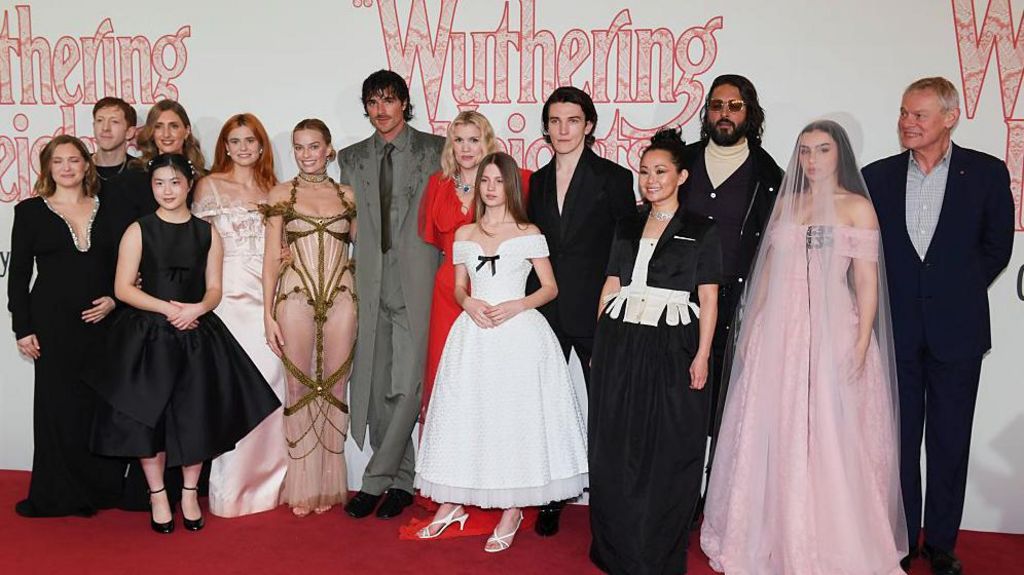 (L to R) Amy Morgan, Robert Cawsey, Vy Nguyen, Jessica Knappett, Alison Oliver, Margot Robbie, Jacob Elordi, Emerald Fennell, Charlotte Mellington, Ewan Mitchell, Hong Chau, Shazad Latif, Charli XCX and Martin Clunes on the red carpet.