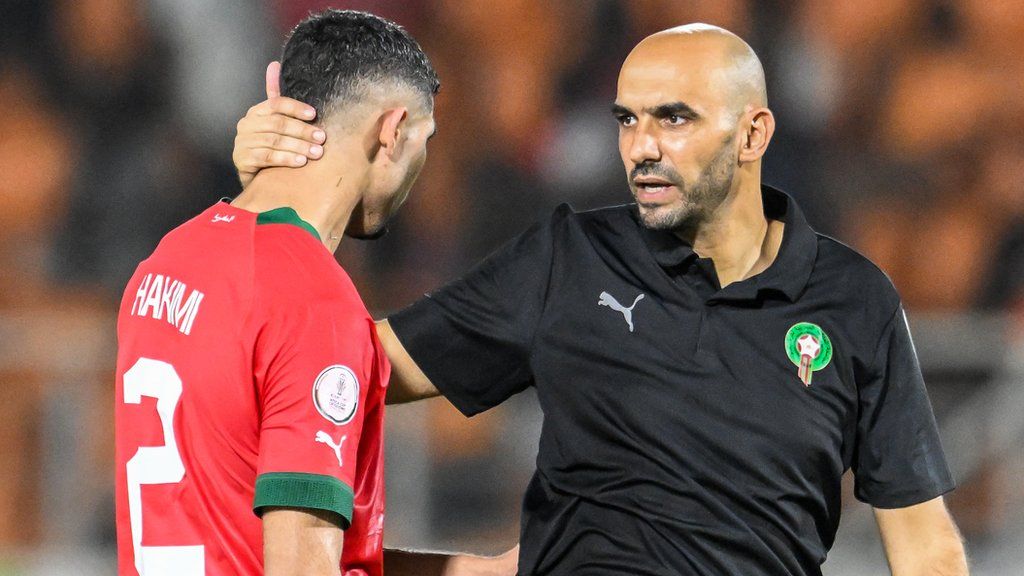 Morocco coach Walid Regragui consoles Achraf Hakimi after their 2-0 defeat by South Africa in the last 16 at the Africa Cup of Nations