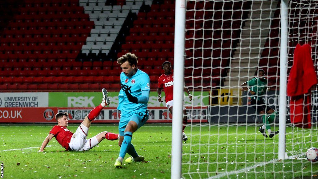 Charlton Athletic's Lucas Ness scores an own goal during the Emirates FA Cup first round match at The Valley, London.