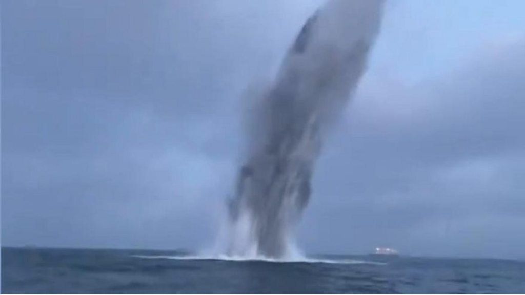 Water spraying up after explosion under the surface of the sea