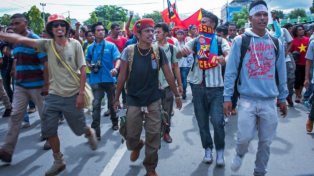 East Timorese activists head toward the Australian embassy during a rally in Dili on February 23, 2016