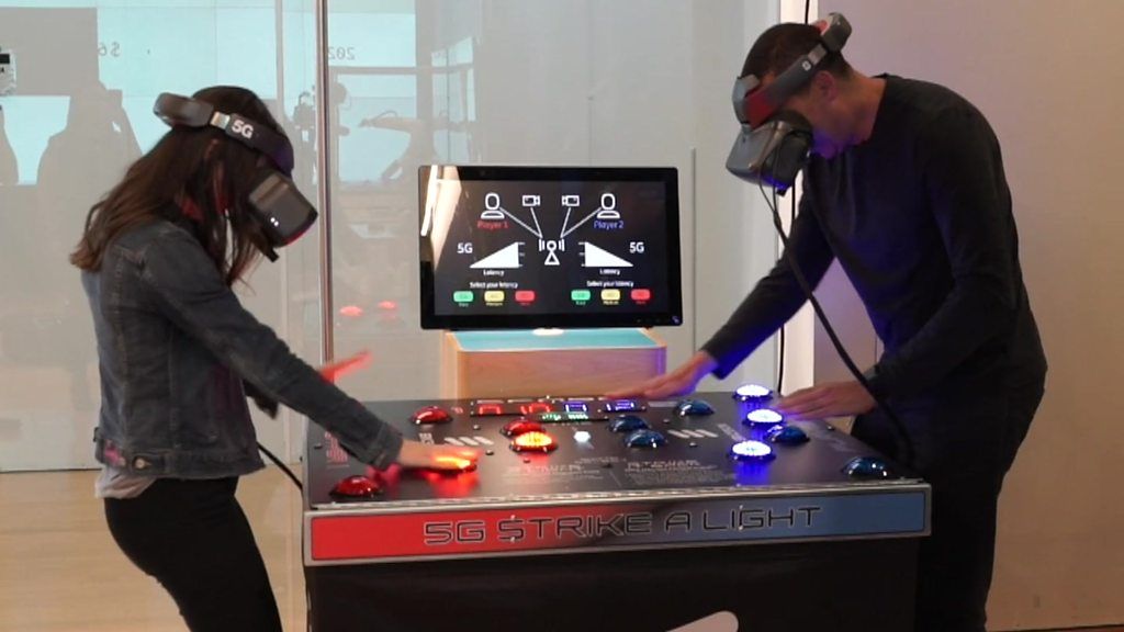 Two people wearing VR headsets playing reaction game