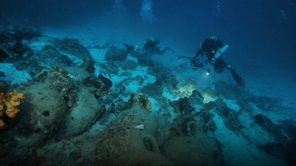 Divers swim over long-forgotten urns