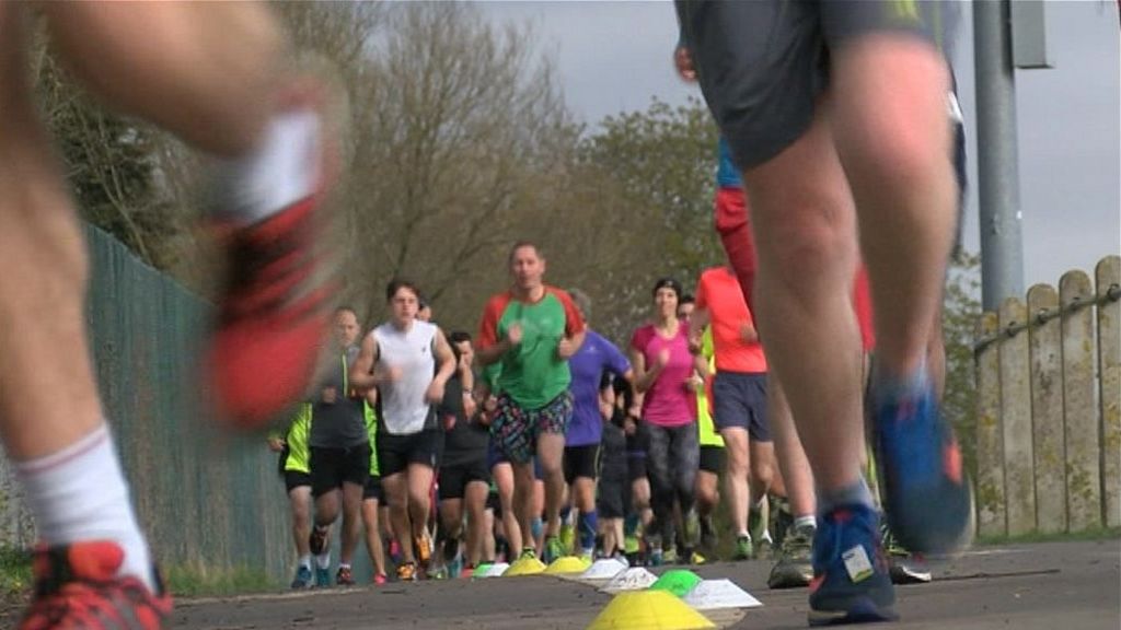 Runners in Little Stoke Park near Bristol taking part in a Parkrun UK event