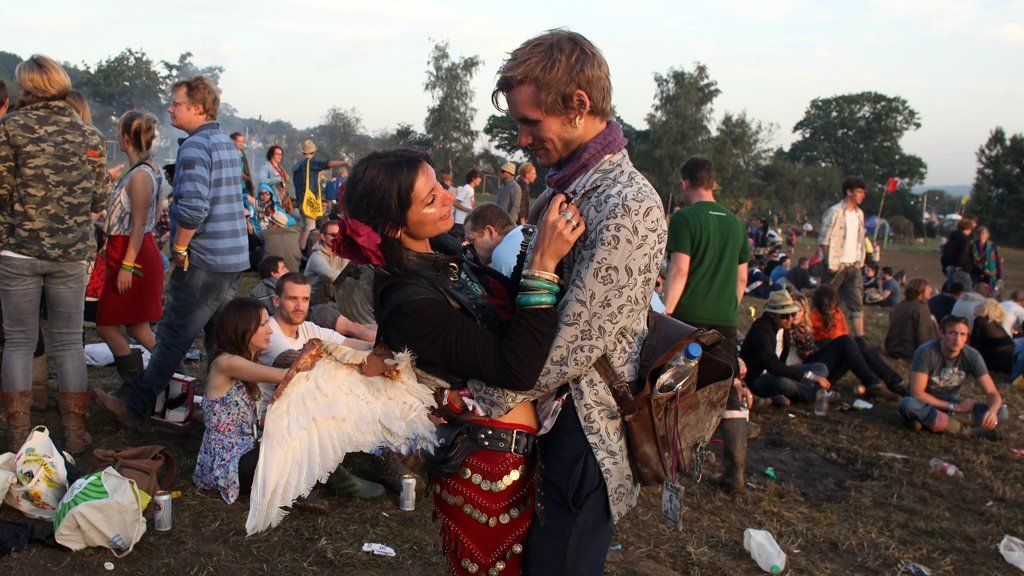 A couple hug at Glastonbury in 2011