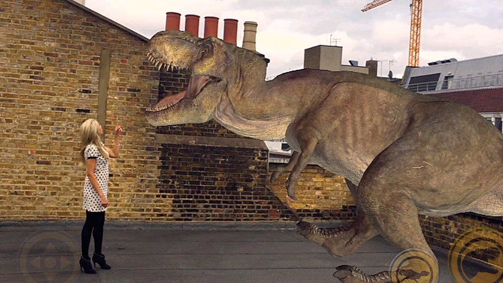 Lara Lewington with an augmented reality dinosaur
