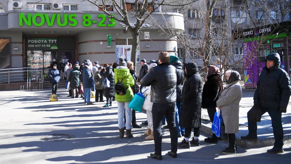 People wait in line at the market on March 1, 2022 in Kyiv, Ukraine. Russian forces continued to advance on the Ukrainian capital of Kyiv