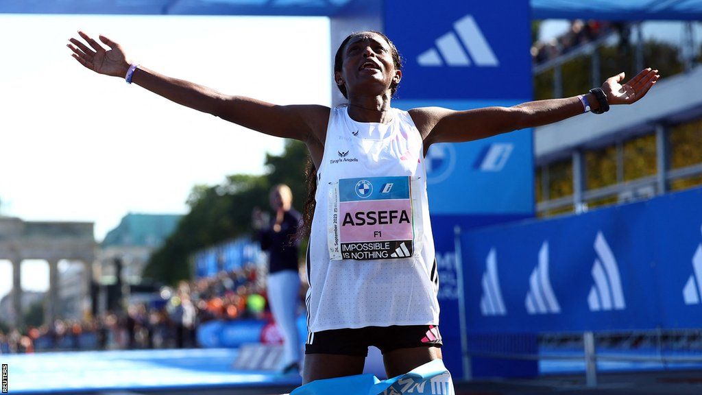 Ethiopia's Tigst Assefa celebrates her women's world record run at the 2023 Berlin Marathon