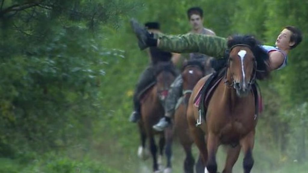 Cossack horsemen riding Russia's growing patriotism - BBC News