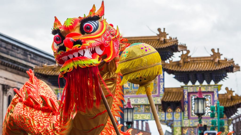 Colourful giant dragon puppet at a Chinese New Year celebration in Liverpool