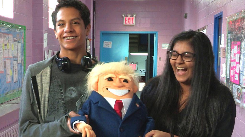 Trump puppet with two students