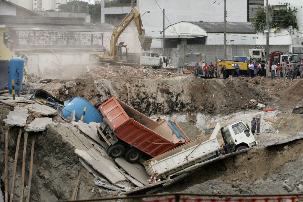 Trucks lay fallen over the rubble of the collapsed 'Pinheiros' subway station in Sao Paulo, Brazil 15 January 2007