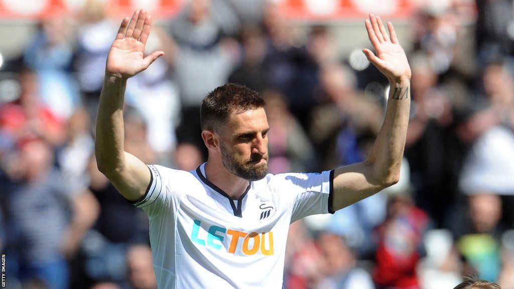 Angel Rangel salutes Swansea fans before his final appearance for the club in 2018