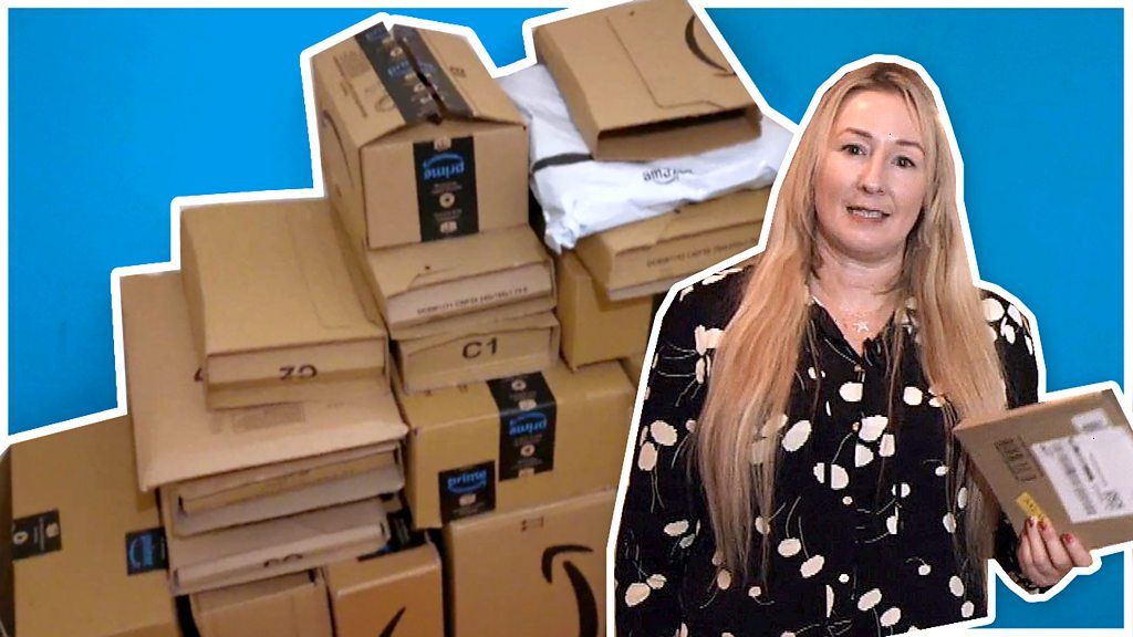 Zoe Kleinman stood next to a pile of package
