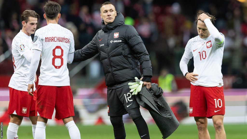Poland players dejected after their draw with Moldova