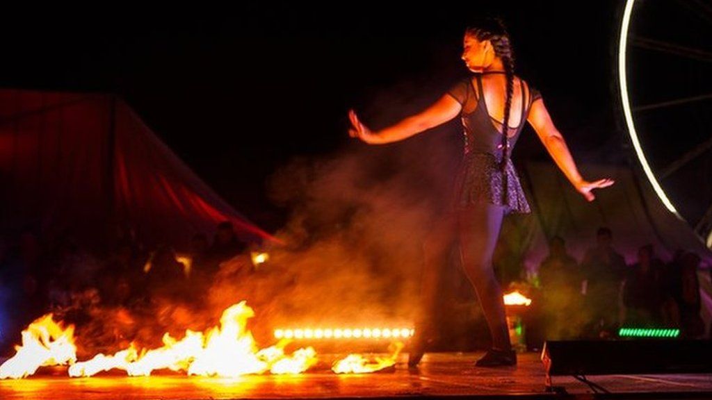 A woman dances at the Fire on the Water festival in Great Yarmouth