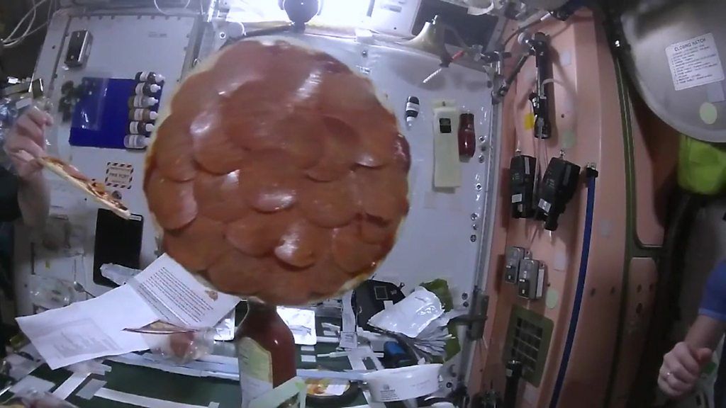 "Flying saucers of the edible kind." it's the first pizza party in space